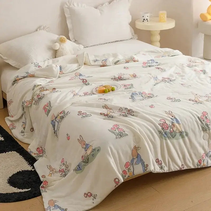 White cooling summer blanket with pastel cartoon rabbits and flowers print for bedroom quilt use