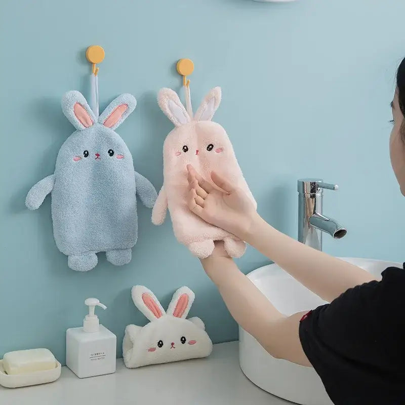 Soft plush pink and light blue microfiber hand towel with cartoon rabbit design for Decorbites cartoon rabbit bathroom decor