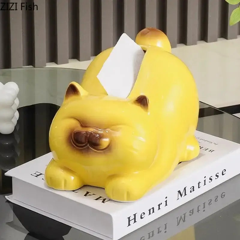 Glossy yellow ceramic tissue box shaped like a sleeping cartoon siamese kitten with brown ear and eye accents decorbites