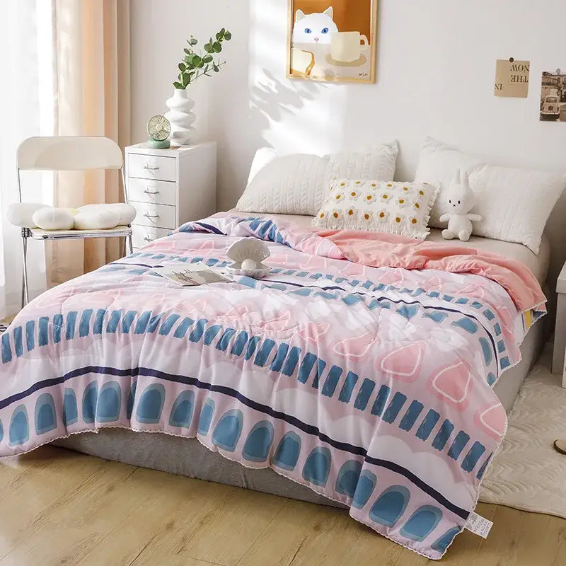 Pink and blue geometric-patterned soft plush quilted double blanket suitable for bedroom use