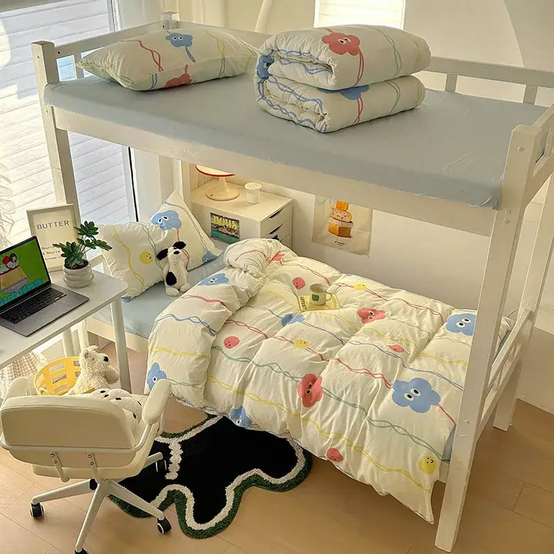 White bunk bed with decorbites cartoon style cream and blue cotton bedding sets featuring cloud and balloon patterns