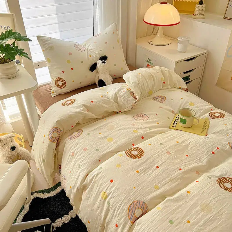 Cream-colored cotton duvet set with playful pastel donuts and polka dots from decorbites cartoon style bedding sets