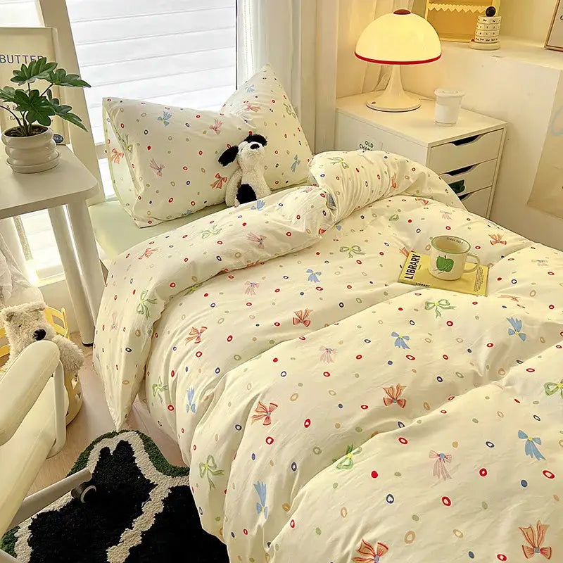 Cream-colored cartoon style cotton bedding sets with pastel bows colorful dots and circles by decorbites