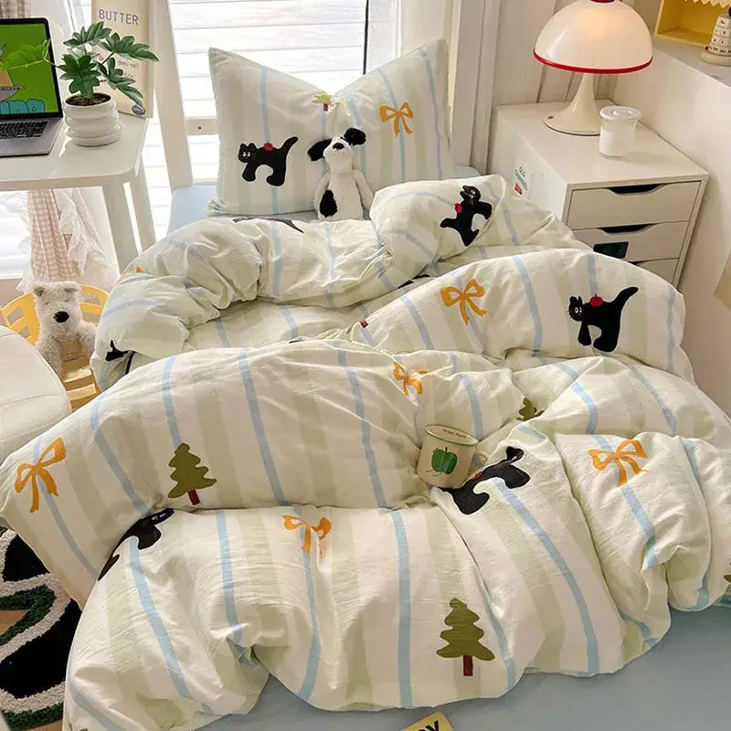 Cream-colored cotton bedding sets with light blue stripes and cartoon style cotton cat print for bedroom decorbites