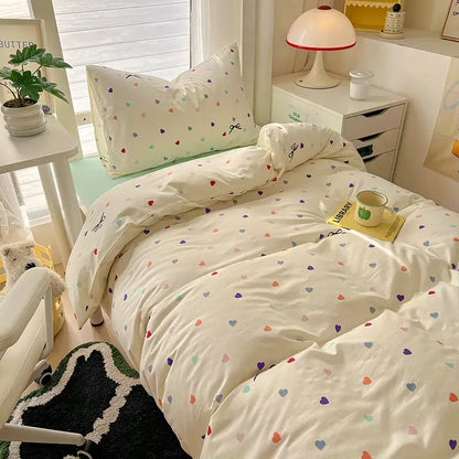 Cream-colored cotton duvet set with multicolored hearts in a decorbites cartoon style bedding sets collection