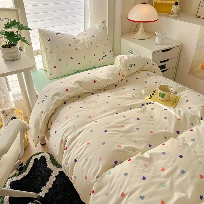 Cream-colored cotton duvet set with multicolored hearts in a decorbites cartoon style bedding sets collection