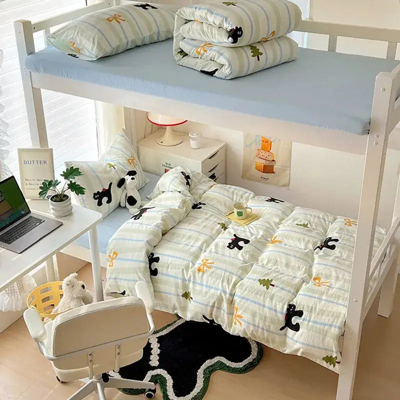 White bunk bed with cartoon style cotton cream and blue bedding sets featuring black cat and yellow bow patterns