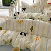 A cream and blue cartoon style cotton bedding set with black cat embroidery by decorbites for cozy bedroom use