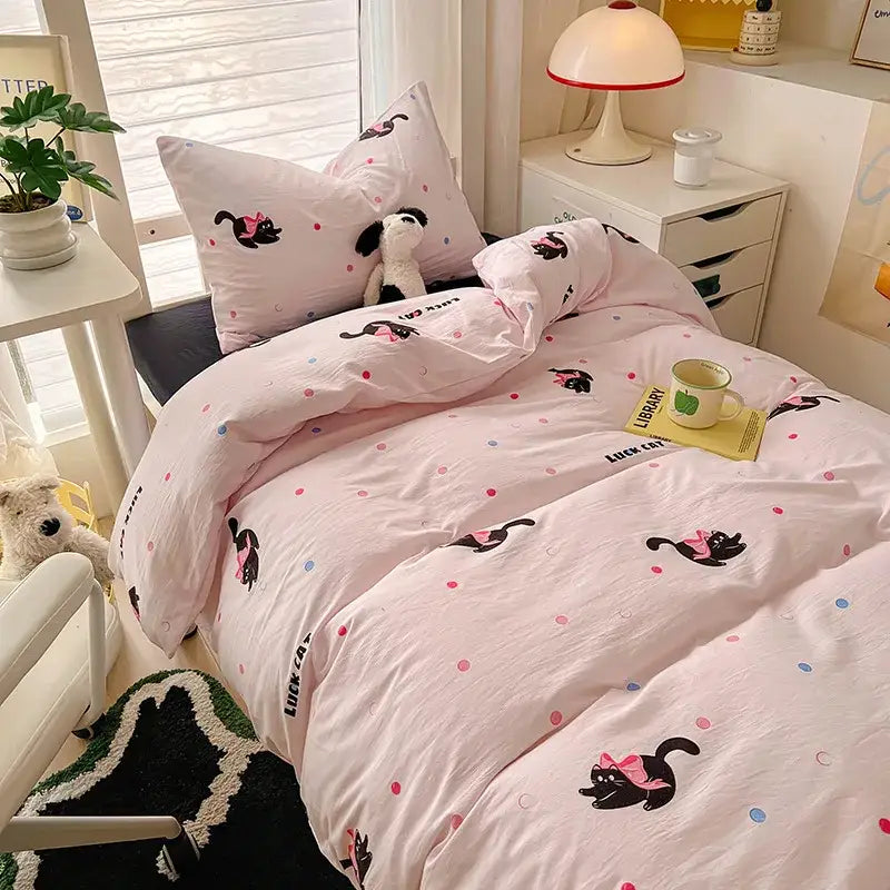 Cream and blue cartoon style cotton bedding sets featuring pink cat-themed design with black cats and polka dots by decorbites