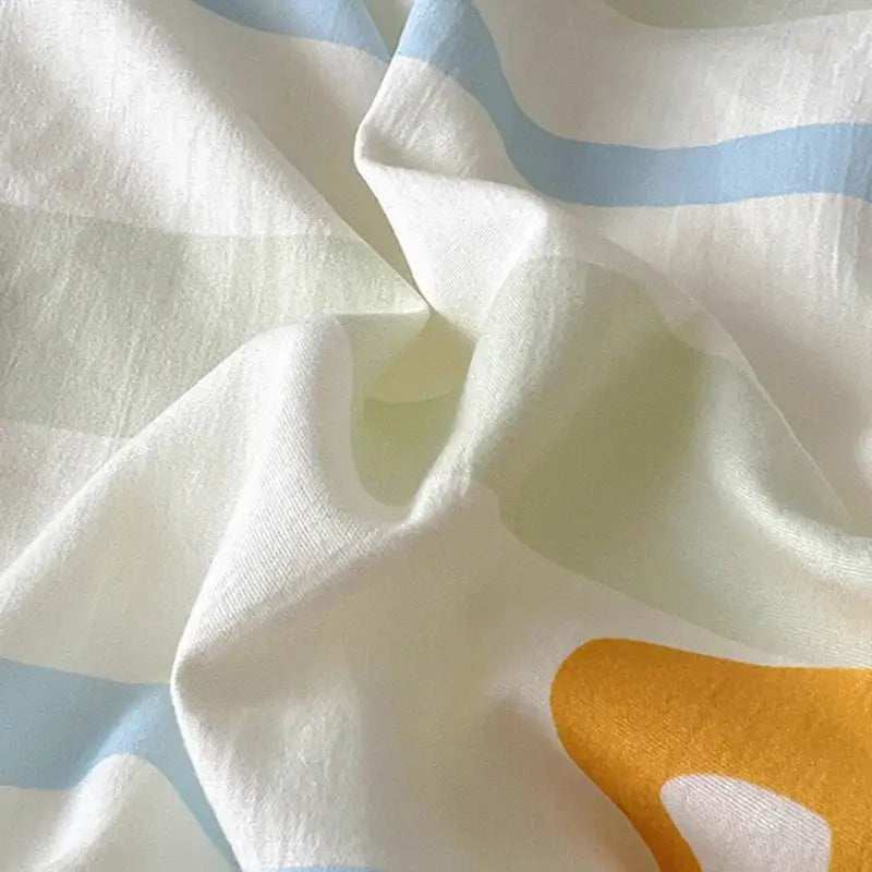 Cartoon style cotton bedding sets featuring soft white fabric with blue stripes and a bold yellow abstract shape