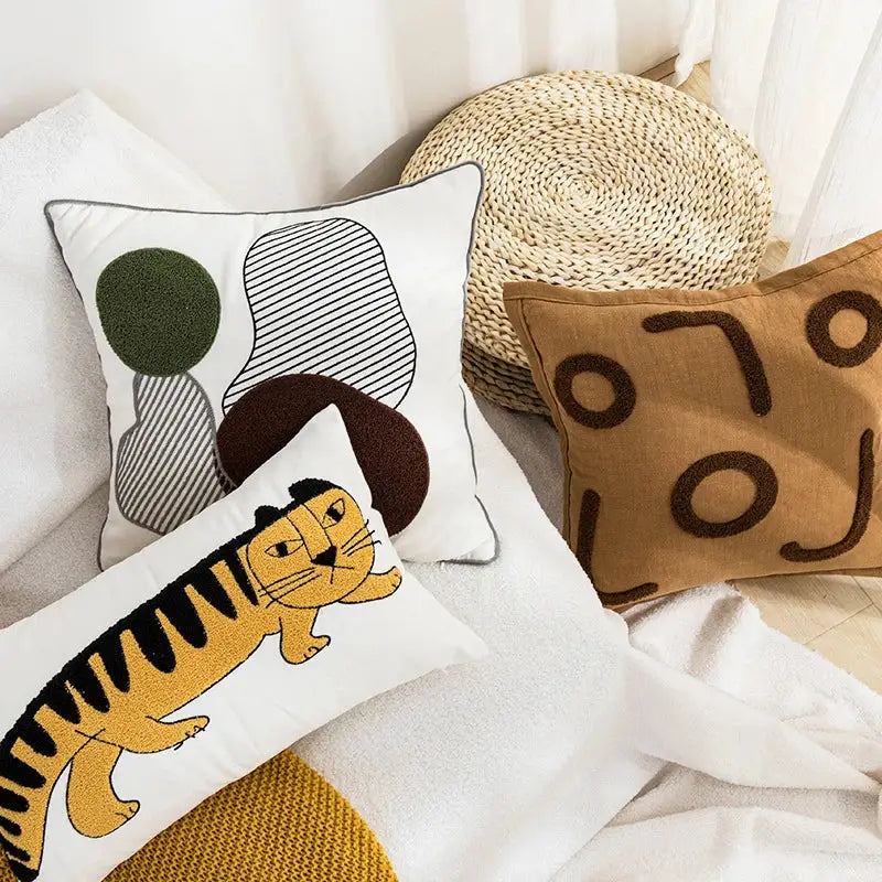 White rectangular cotton pillow cover with a cartoon tiger embroidered in yellow and black decorbites cartoon tiger design
