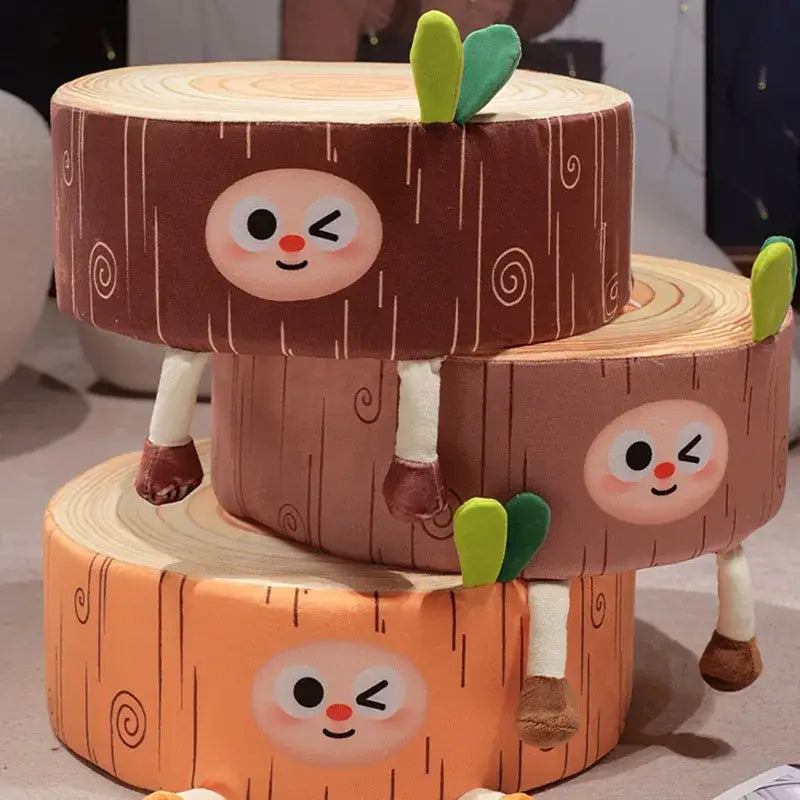 Three stacked brown plush cartoon tree stump cushions with green leafy tops for bedroom decor by decorbites cartoon tree