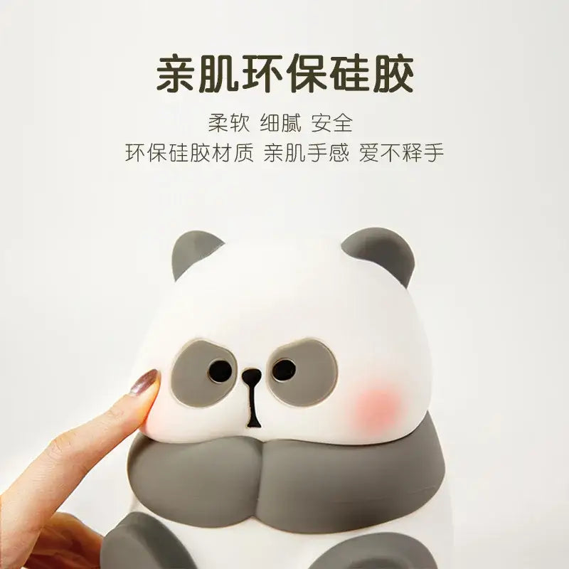 A soft white and gray panda-shaped silicone night light from decorbites cartoon for kids room decor