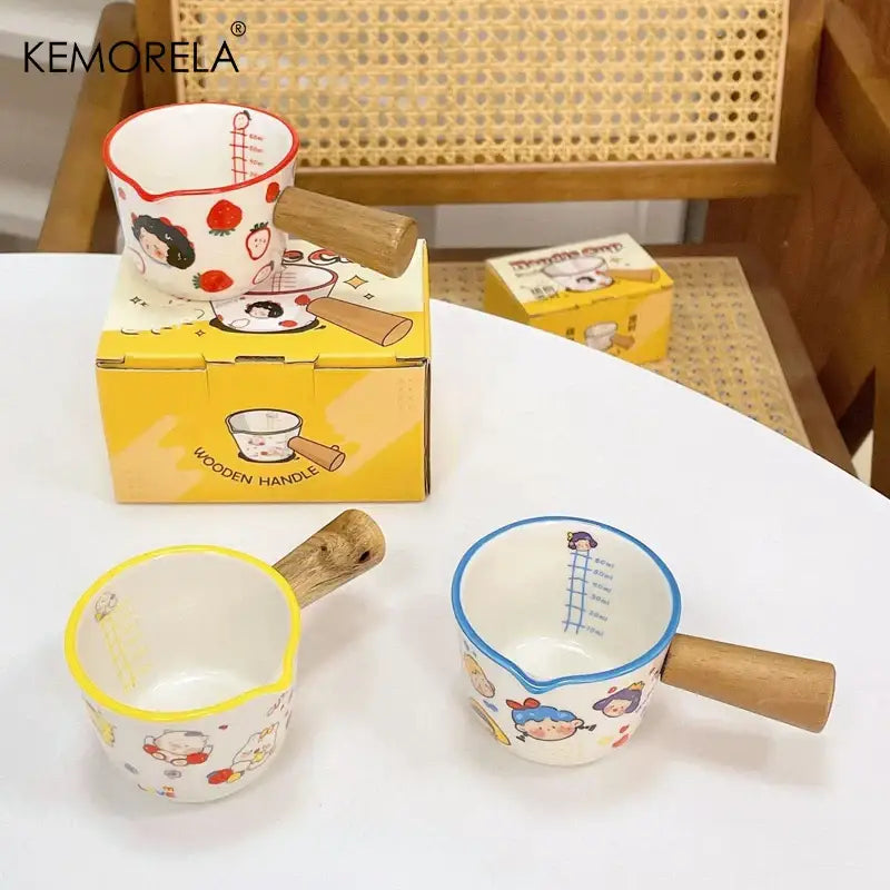 White italian ceramic measuring cups set with colorful cartoon designs wooden handles and red and blue rims decorbites italian ceramic