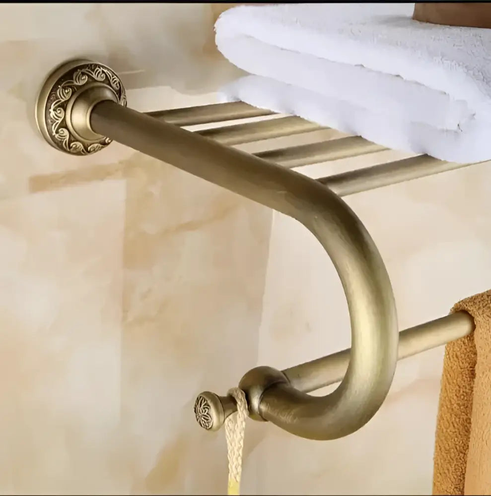 Antique bronze brass bathroom towel rack with carved antique decorbites finish and ornate circular wall mount