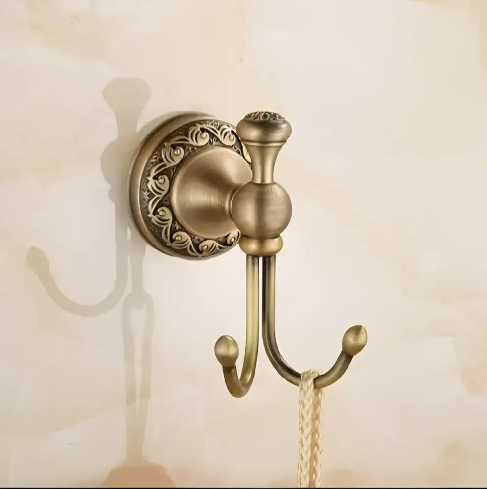 Antique bronze brass double hook with carved antique floral detailing and textured rope from decorbites bathroom hardware set