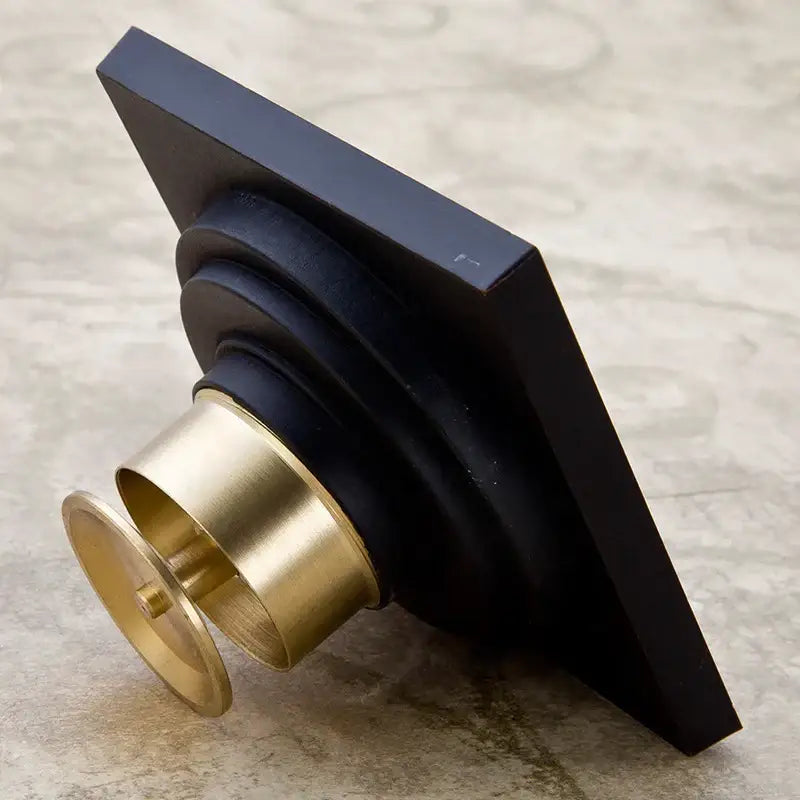 Carved black bronze floor drain with brass fluted design and concentric rings for decorbites black anti-odor use