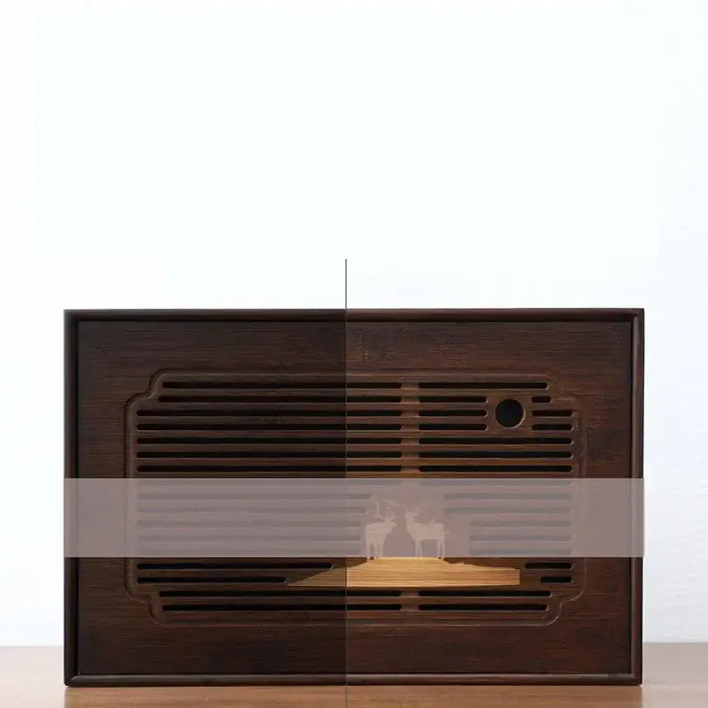 Dark brown bamboo tea tray with carved deer motif and horizontal slats for dining room drainage use