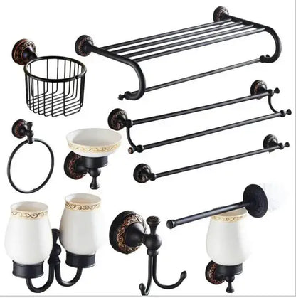 Black metal bathroom accessory set with carved flowers blackened copper and white ceramic cups with gold trim by decorbites