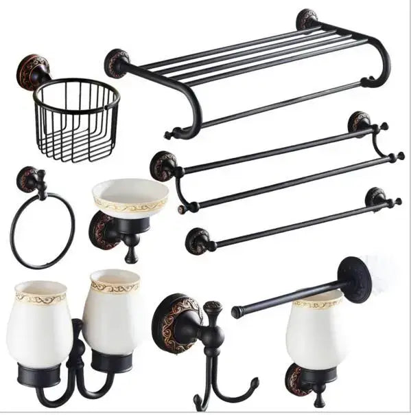 Black metal bathroom accessory set with carved flowers blackened copper and white ceramic cups with gold trim by decorbites