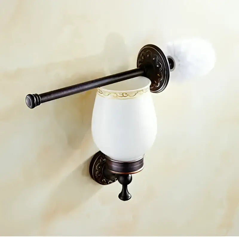 Antique bronze-finished toilet brush holder with white ceramic cup featuring ornate decorbites carved flowers blackened copper detailing