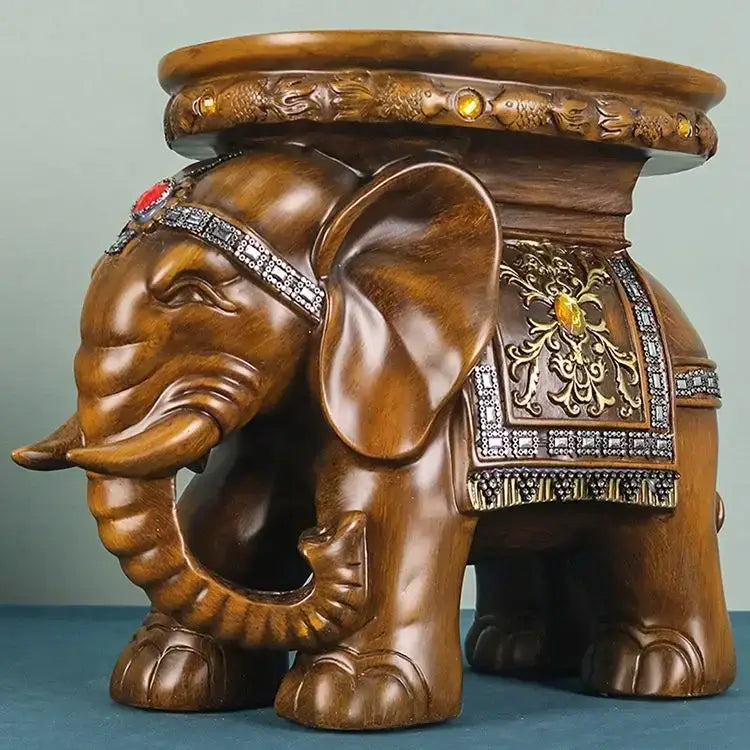 Carved wood elephant wealth attracting stool with intricate metalwork gemstone accents and decorative saddle pattern