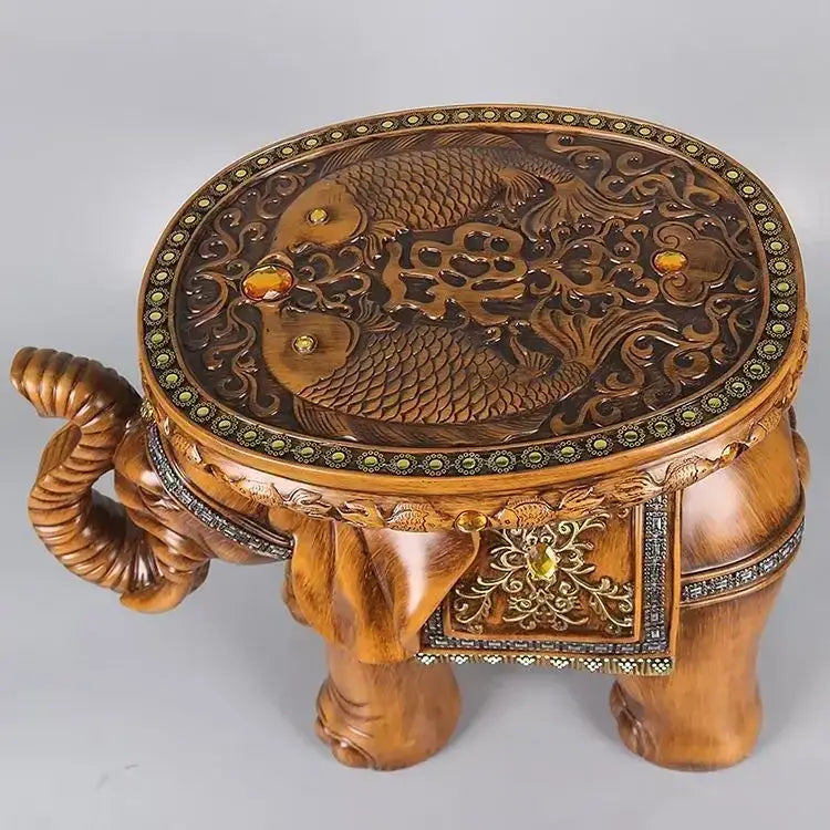 Carved wooden elephant wealth attracting stool with amber stones and fish floral designs for living room use