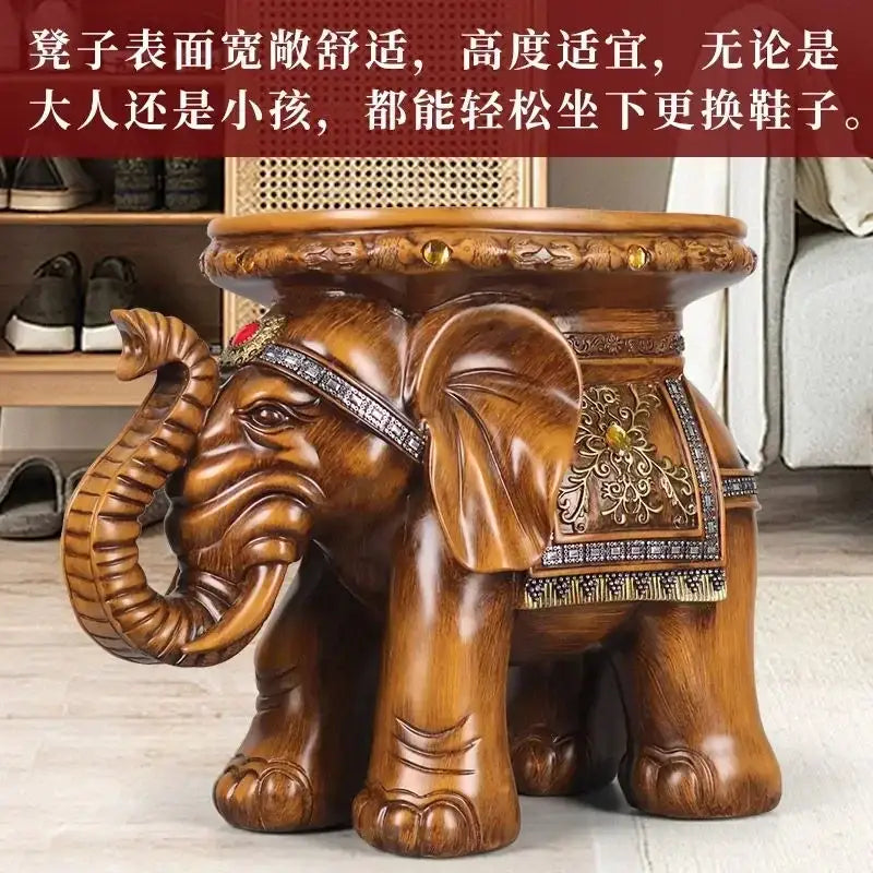 A polished brown resin carved wood elephant wealth attracting stool with gold and silver accents for living room use