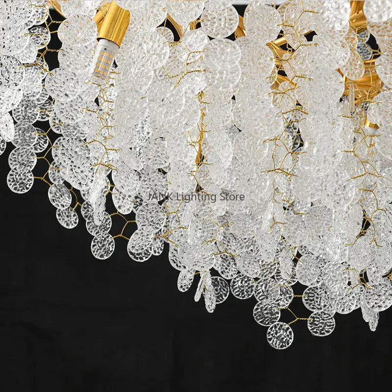 A cascading gold circular crystal chandelier with clear textured glass discs for elegant living room decorbites circular crystal lighting