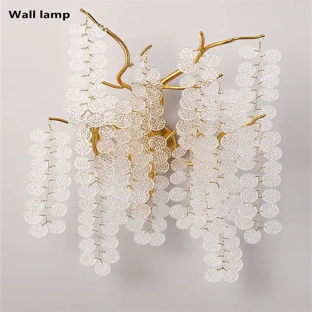 Gold-toned circular crystal chandelier wall lamp with cascading clear textured glass discs for living room decorbites style