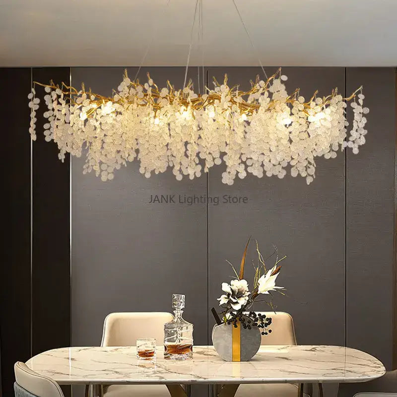 A cascading gold circular crystal chandelier with golden branch design and clear petal-shaped glass for living room decorbites circular crystal decor