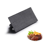 Black cast iron steak press plate with grid pattern designed to imprint classic sear marks on meat