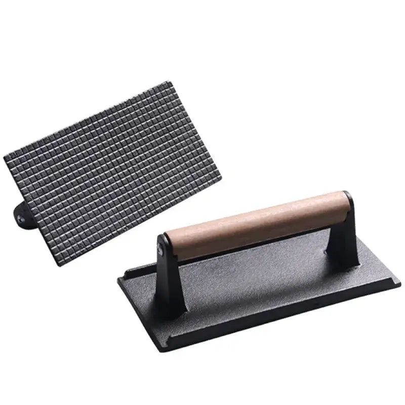 Black cast iron steak press plate with wooden handle and grid pattern for kitchen meat tool use