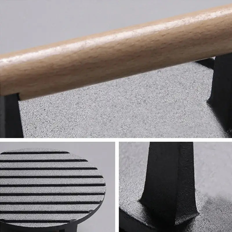 Black cast iron steak press plate with light wood handle kitchen tool for grilling and pressing steaks
