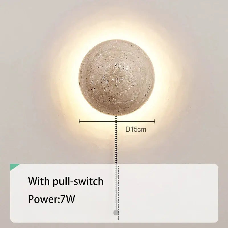 A cave stone yellow textured sphere wall lamp with warm glow for bedroom ambiance by decorbites cave stone