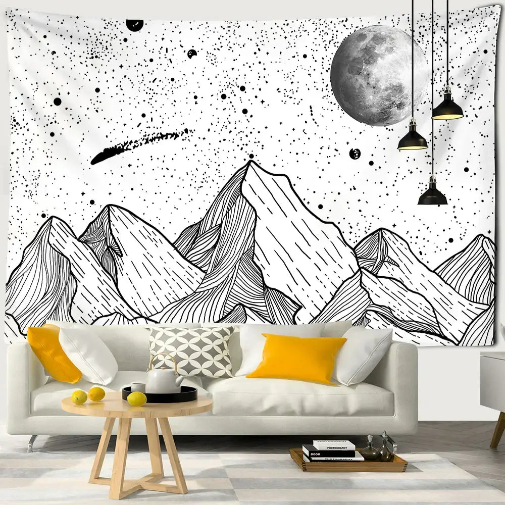 Celestial black and white stars mandala tapestry featuring white stars moon and comet design hanging above sofa