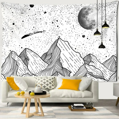 Celestial black and white stars mandala tapestry featuring white stars moon and comet design hanging above sofa