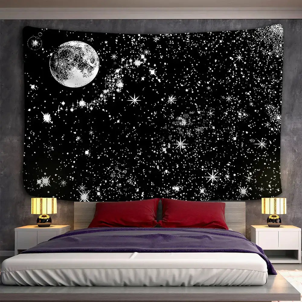 Black tapestry featuring a white stars mandala design with detailed moon and starfield hanging above a bed