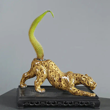 Ceramic animal flowerpot leopard with glossy golden-brown glaze and green cactus from decorbites ceramic decor