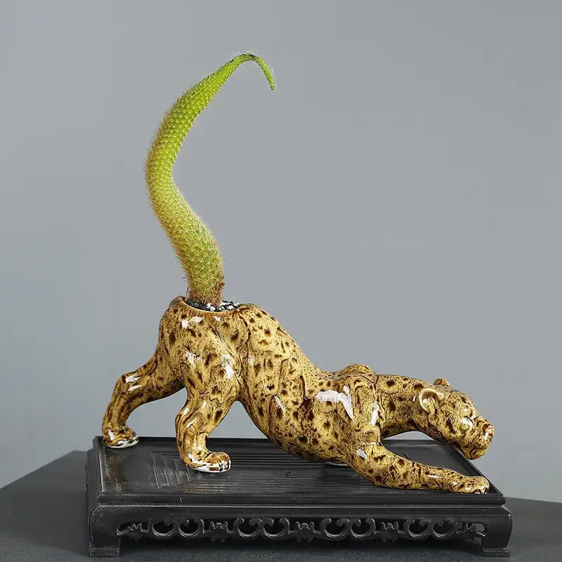 Ceramic animal flowerpot leopard with glossy golden-brown glaze and green cactus from decorbites ceramic decor