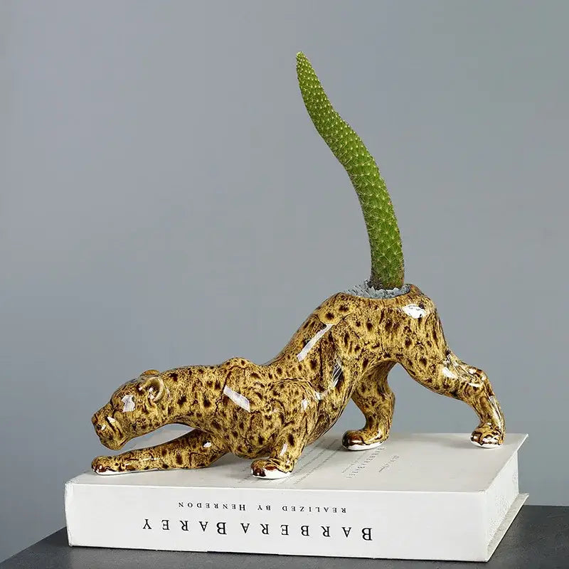 Glossy ceramic animal flowerpot leopard with tan and brown spots featuring a green cactus by decorbites ceramic