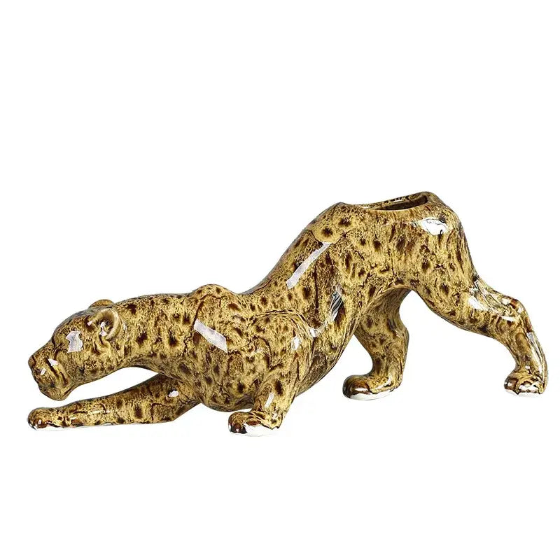 A glossy decorbites ceramic animal flowerpot shaped like a stretching leopard with brown and tan spotted patterns