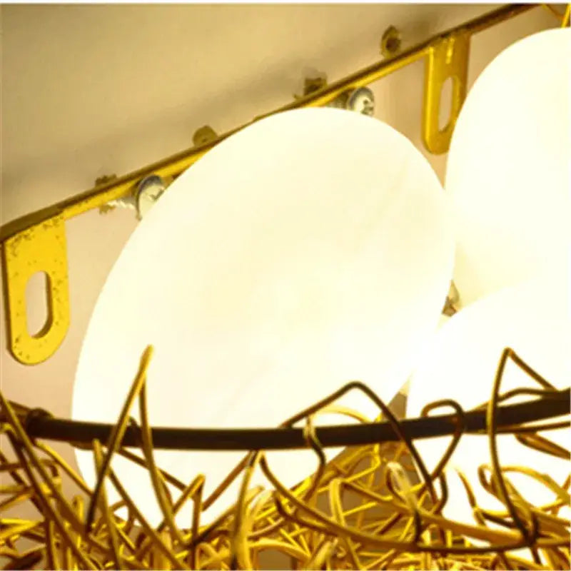 Gold-toned wire nest led wall lamp with frosted white spherical glass shades for bedroom sconce lighting