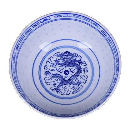 A white ceramic dragon print nested bowl set with blue hand-painted motifs and yin-yang symbol for dining room decorbites ceramic dragon
