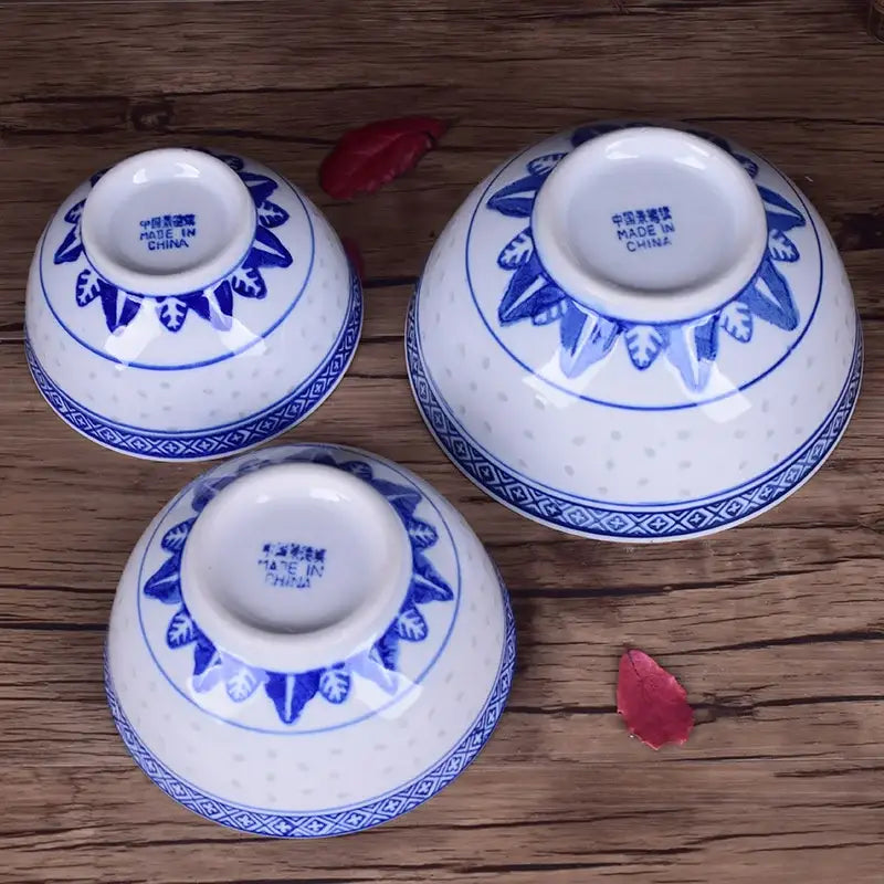 Three white ceramic dragon print nested bowls set with blue floral and geometric patterns for dining room decorbites ceramic dragon
