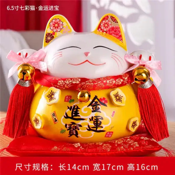 A cheerful white ceramic maneki neko piggy bank with yellow belly red lace and pink bows for living room decorbites ceramic maneki