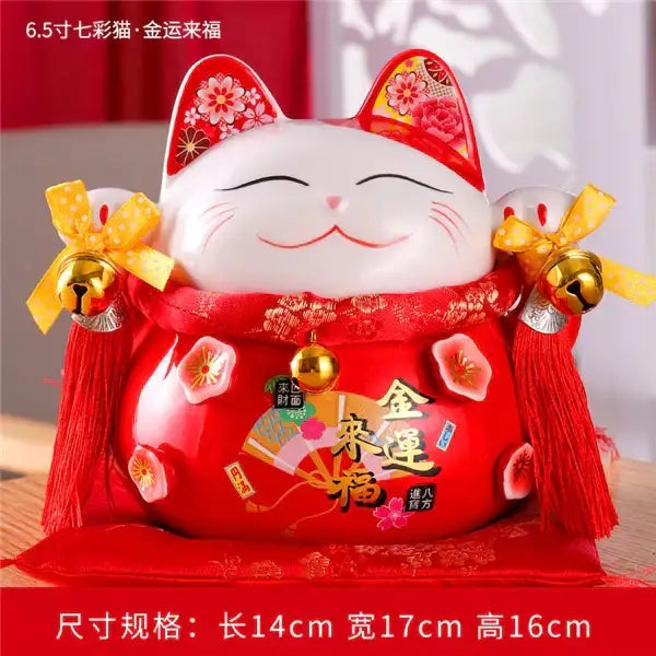 Glossy red ceramic maneki neko piggy bank with white face floral patterns gold bells for living room decor