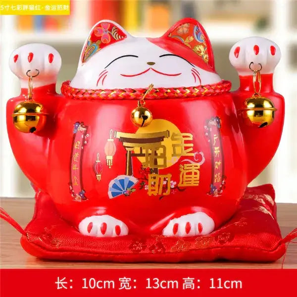 Red ceramic maneki neko piggy bank with gold accents bells and decorative chinese characters for decorbites ceramic maneki decor