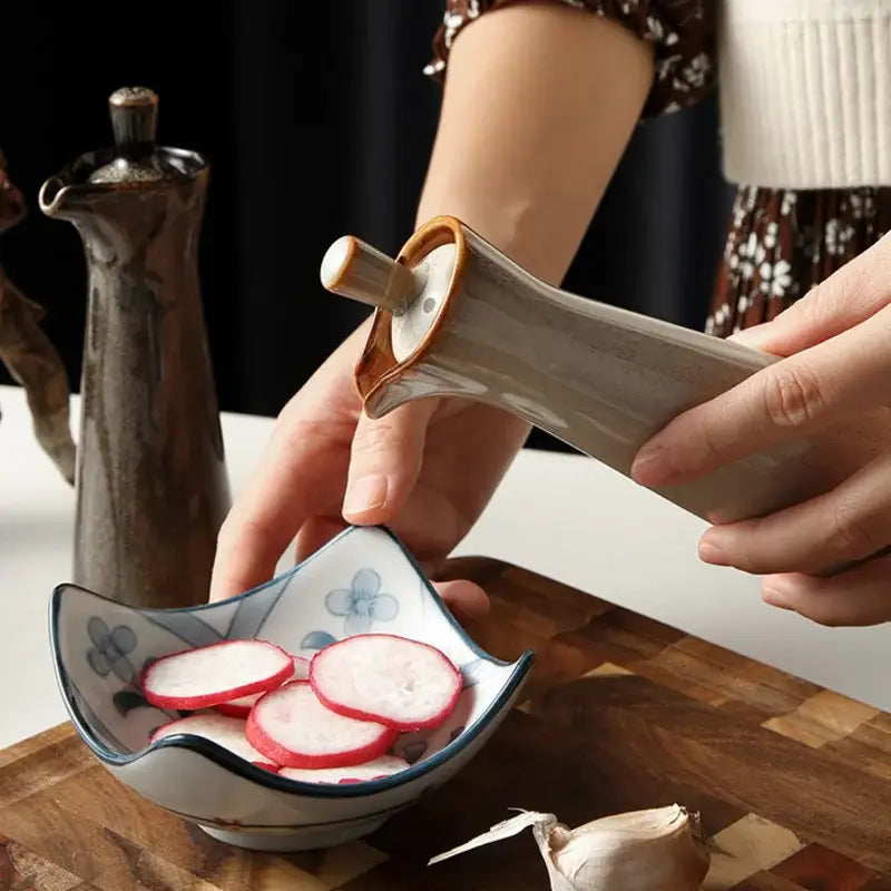 A sleek matte ceramic seasoning pot with a warm brown wooden cap and handle from decorbites ceramic seasoning