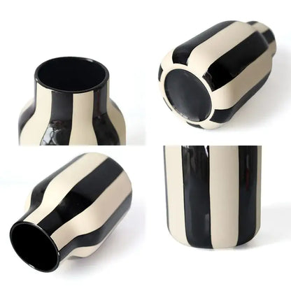 Black and cream striped ceramic vase with a glossy finish showcasing a unique red striped ceramic vase design